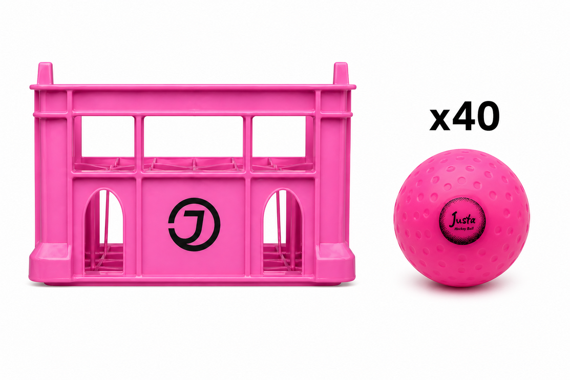 Justa Pink Practice Ball Bundle 2026/27 | 40 pink hockey balls housed in a heavy-duty rigid plastic storage crate
