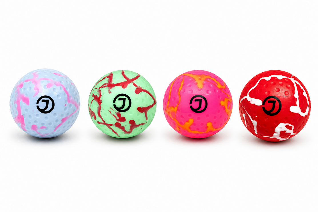 Justa Dimple Swirl Practice Hockey Balls in colorful patterns including Bubblegum and Rhubarb and Custard