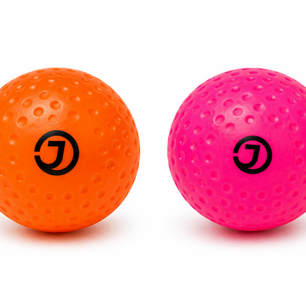 Justa Dimple Light Practice Hockey Balls in Pink and Orange | Lightweight 3.5oz balls for junior players